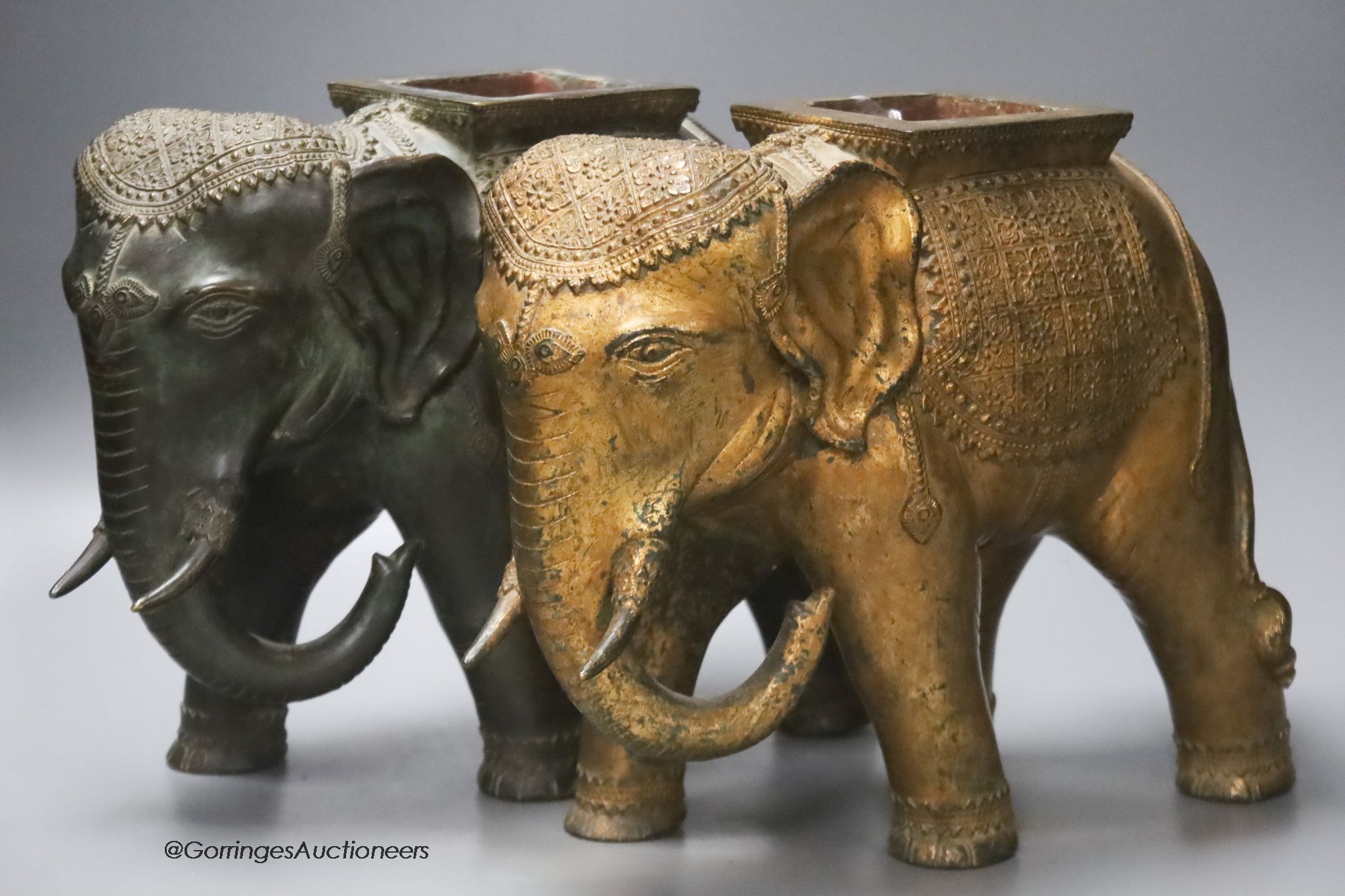 A pair of Indian bronze elephant jardinieres, height 26cm